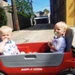 twin toddler boys sitting in a wagon toys that twins can share