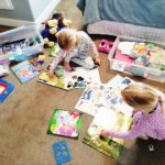 two girls playing in their room with quiet time boxes