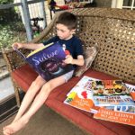 boy reading books diversify