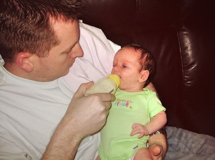 dad bottle feeding baby exclusively breastfed twins