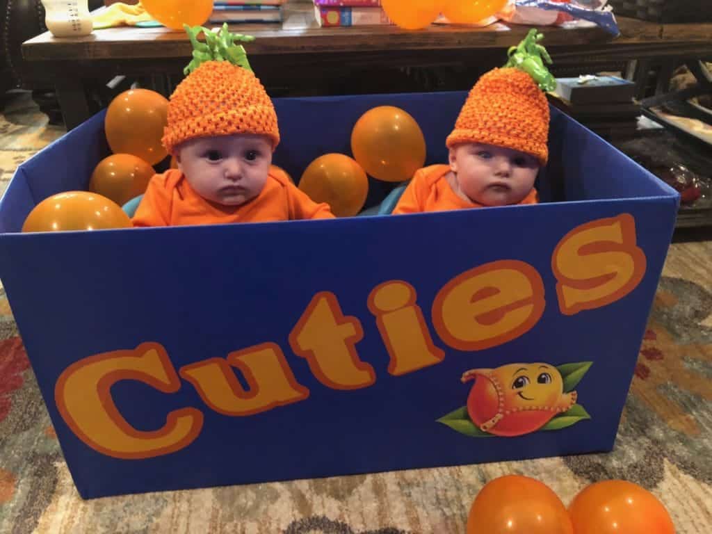 twin girls dressed as cuties oranges twin girls halloween costumes