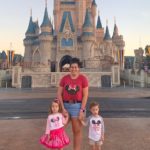 mom with 3 year old twins in front of cinderella's castle in the magic kingdom disney world alone