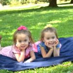 twin girls on a blanket pros and cons of identical twins