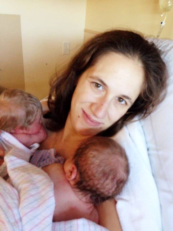 mom holding twins after birth