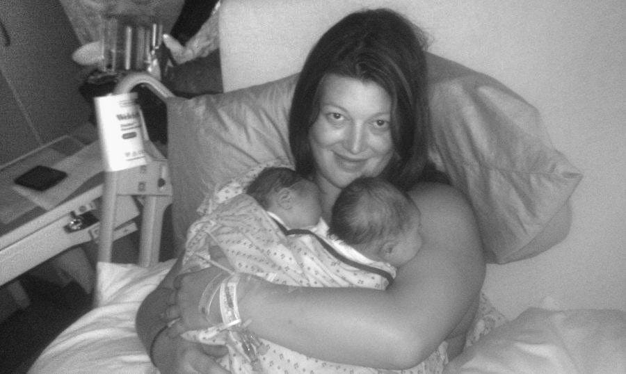 mom holding twins after birth