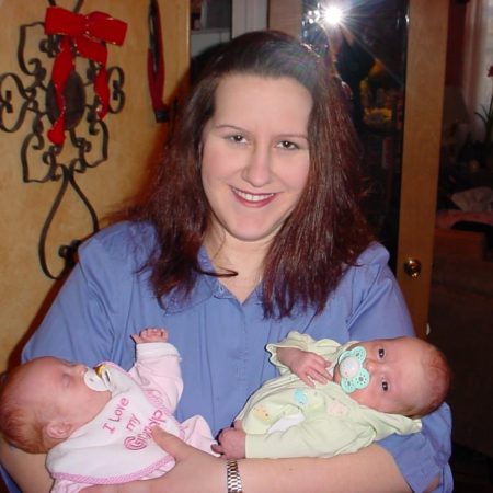mom holding newborn twins
