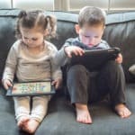 two kids playing tablets Apps for Ages 2-6