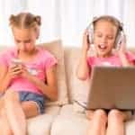 middle school twin girls on couch