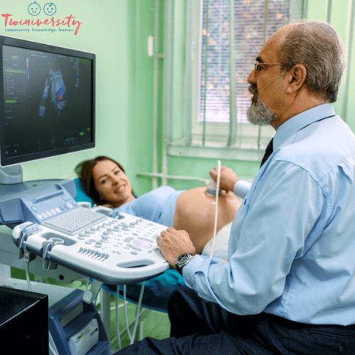 a pregnant woman receives an ultrasound from her doctor